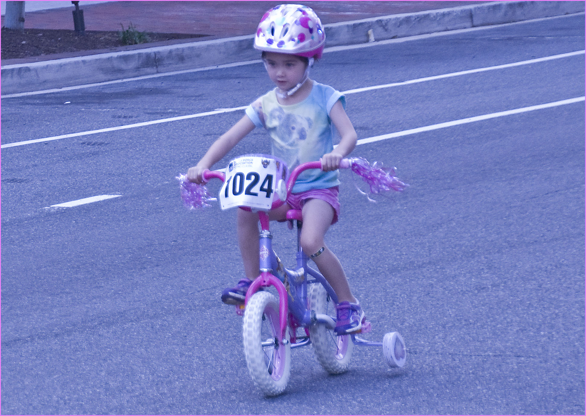  in a bicyclist helmet on the street