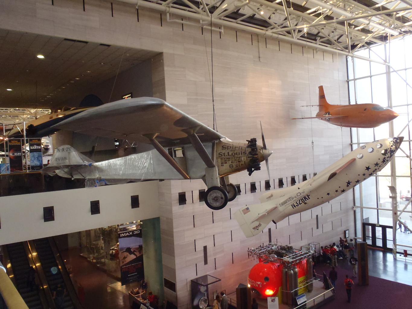 several planes are displayed in an air museum