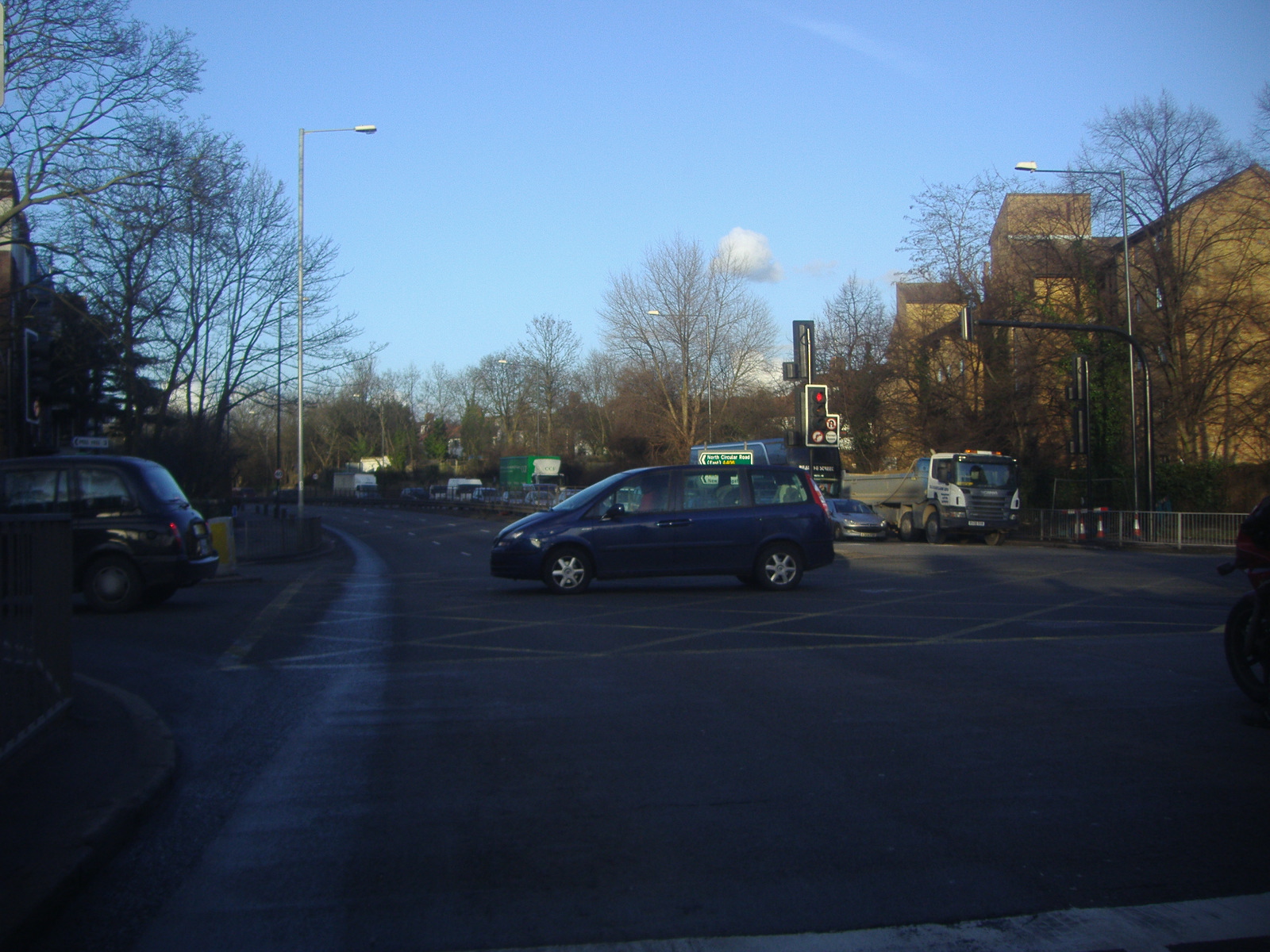 a car is stopped at the traffic signal