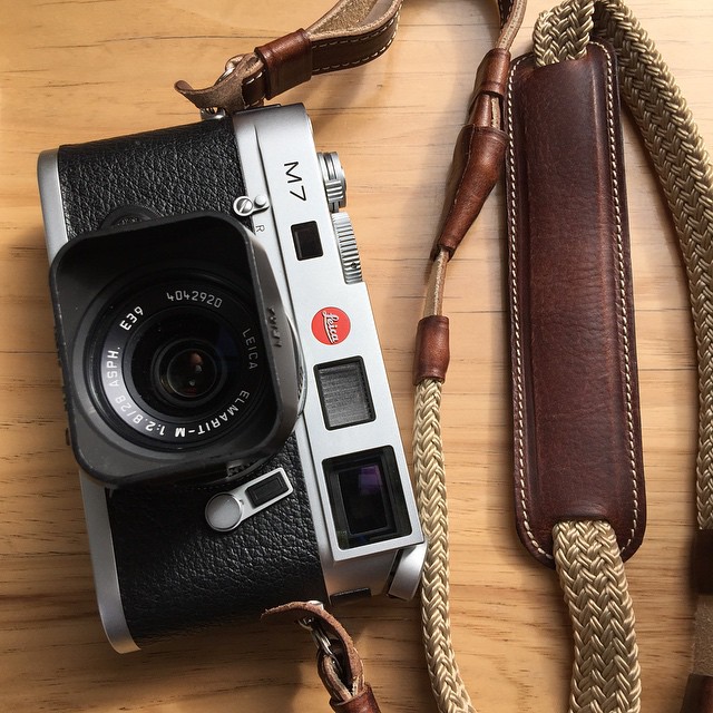 there is an old style camera on the table