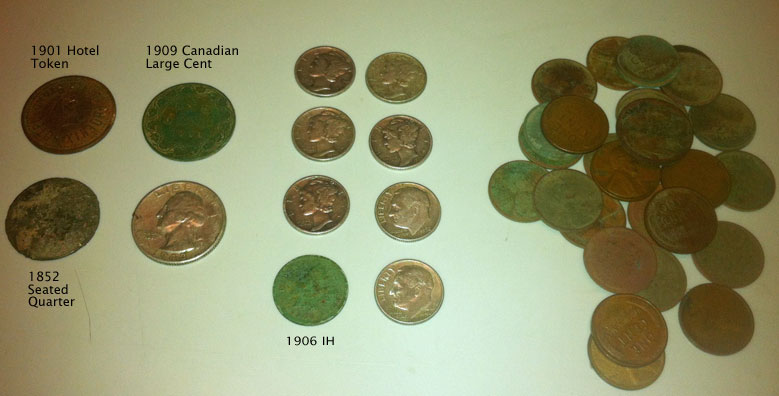 a white counter topped with lots of different types of coin