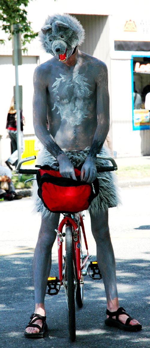 a man that is sitting on a bicycle