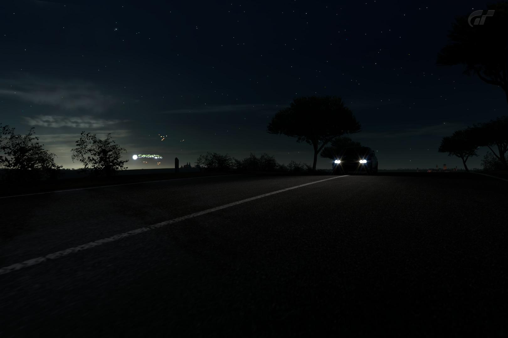 the car is traveling in the dark road at night