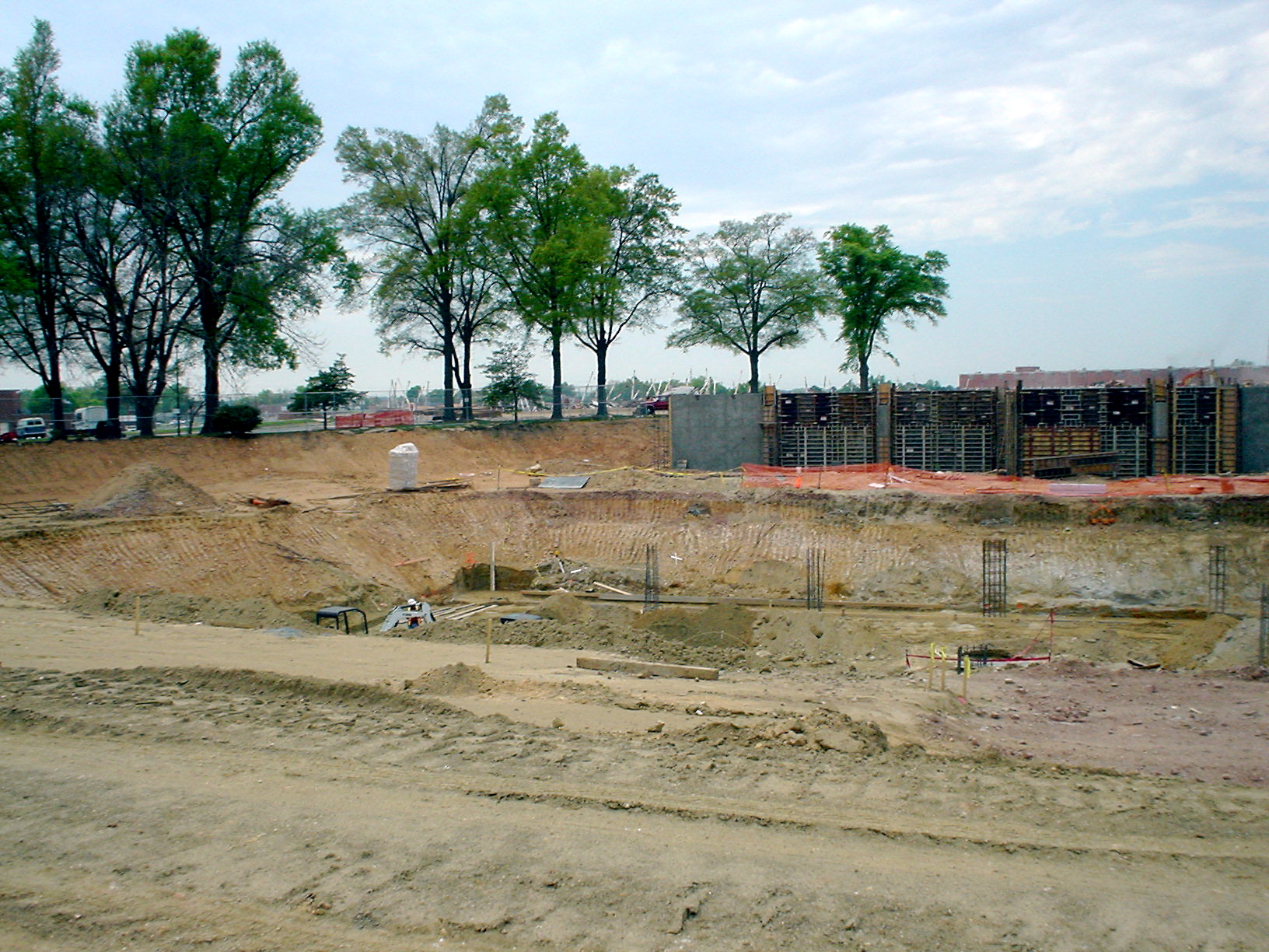 a group of building equipment is being constructed on the side of a field