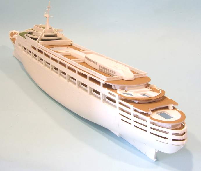 a model cruise ship is on display on a gray background