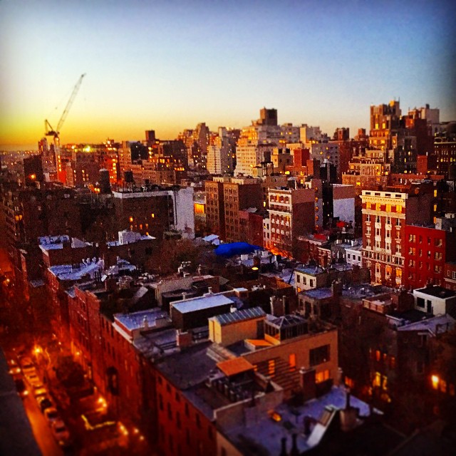 a view of the city skyline at dusk