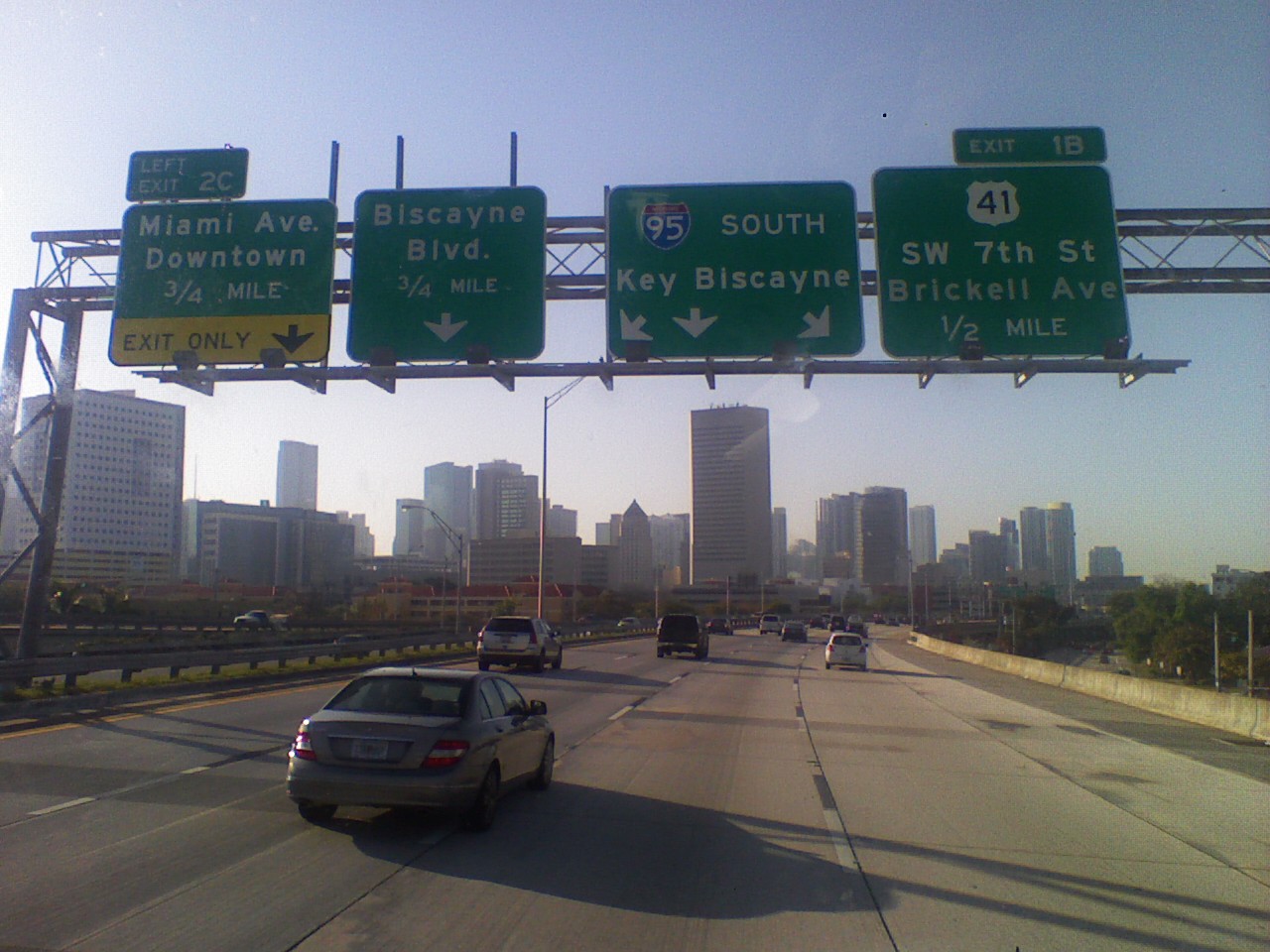 an interstate freeway sign over the highway with highway directions
