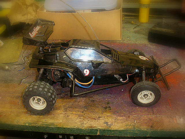 the black remote controlled car is on display