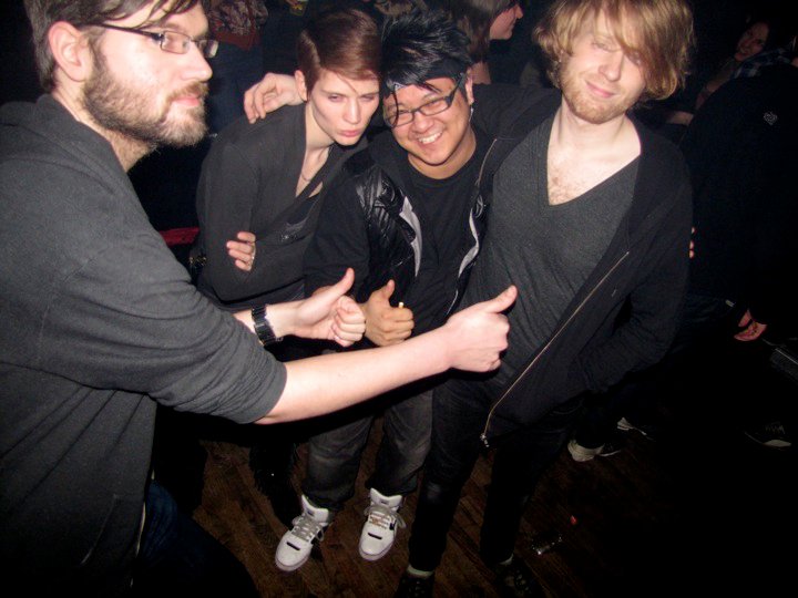 a group of people standing around at a party