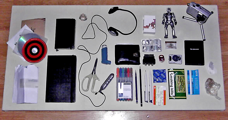 an assortment of electronic gadgets on a  board