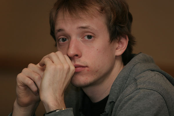 a young man looking intently at the camera