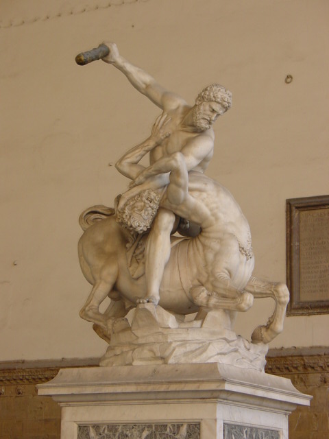 a statue with a horse, the man on horseback