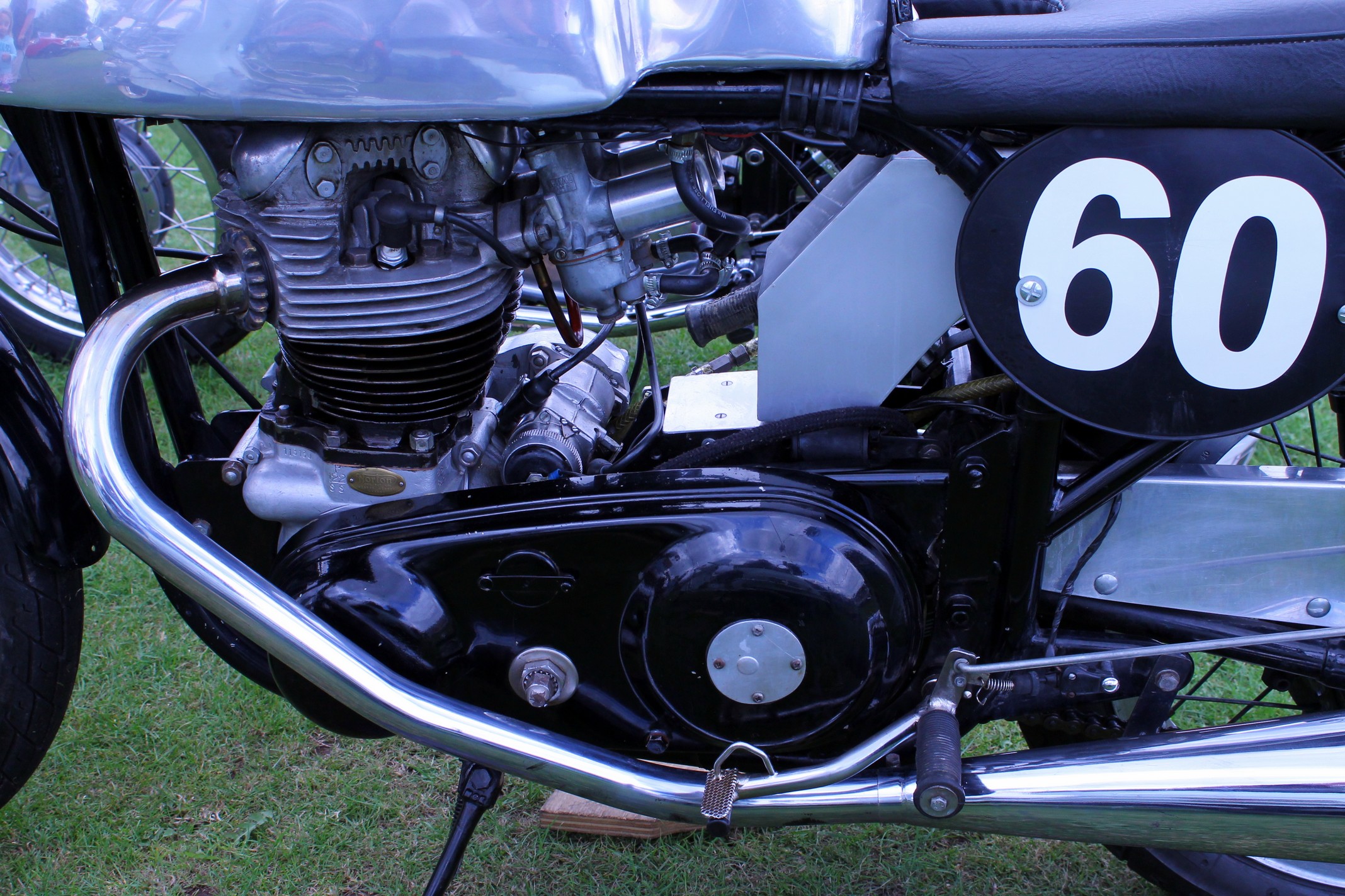 the number sixty motorcycle sitting on display on a field