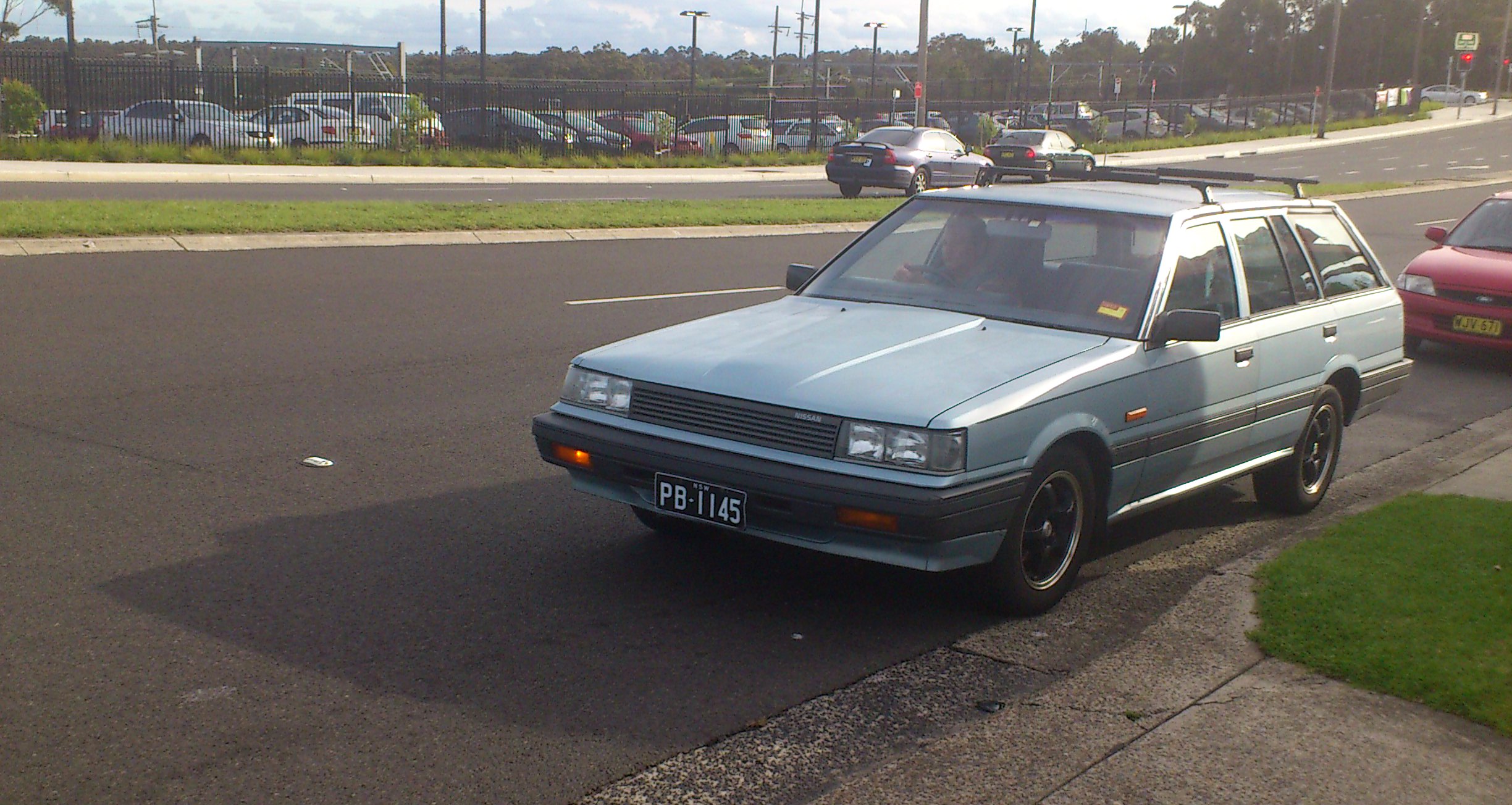 a car that is driving down the street