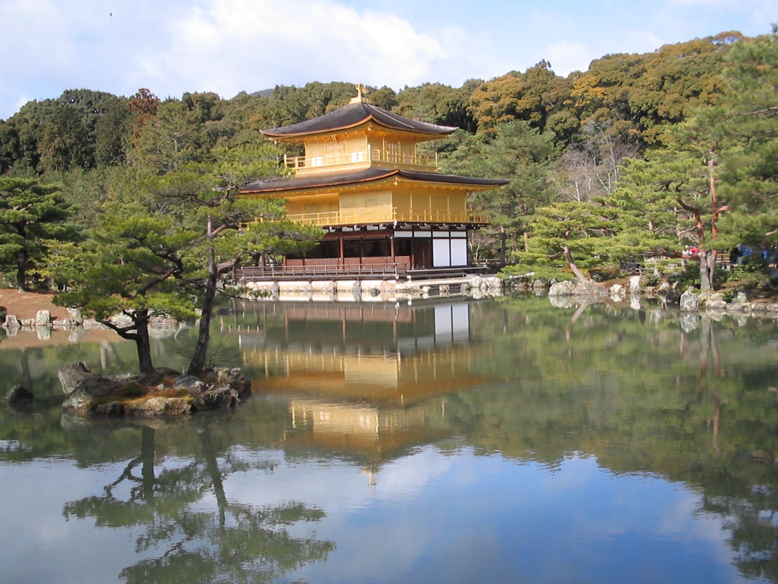 a reflection of a temple in a body of water