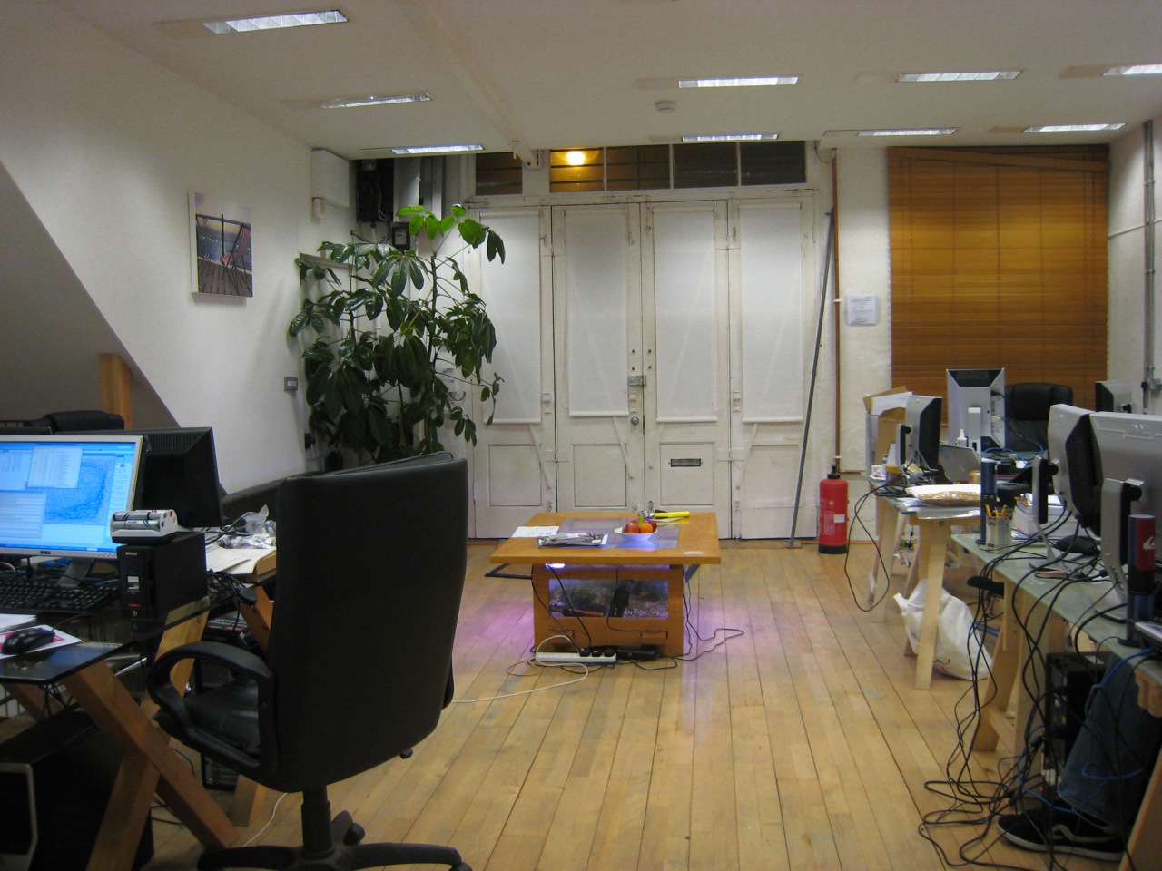 a large work office with a desk and chair