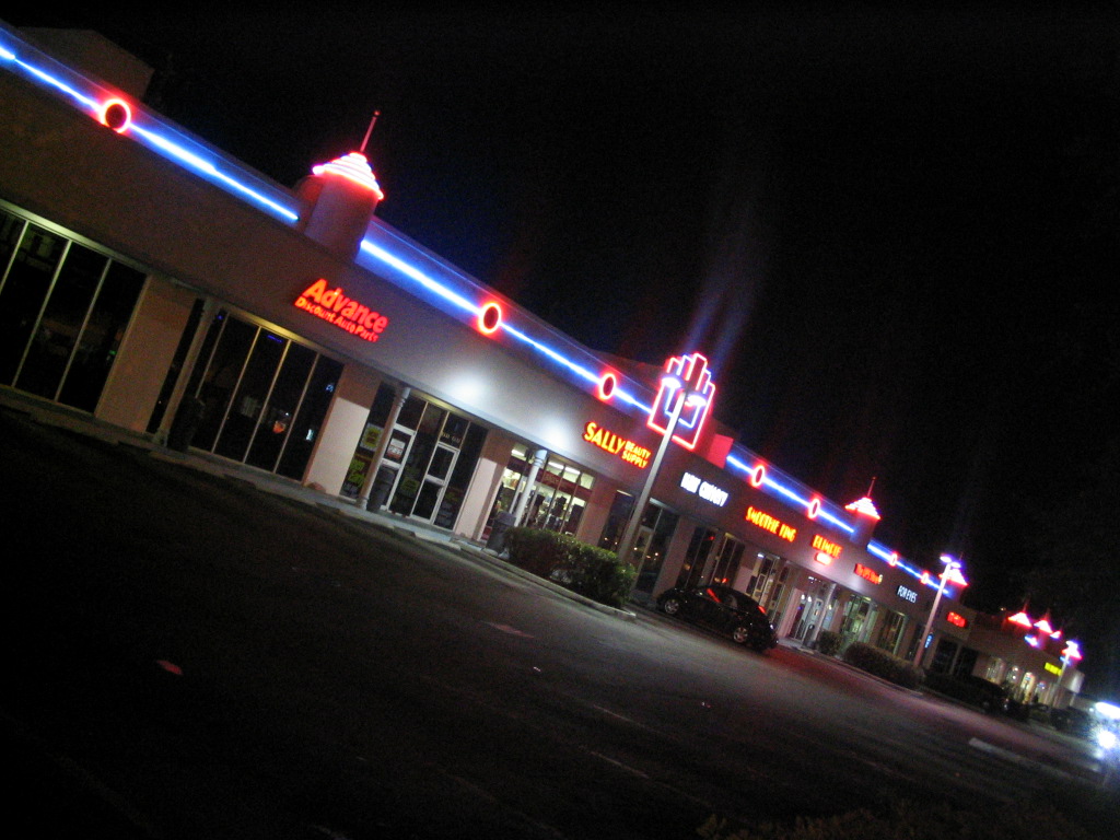 a store front with the lights on at night