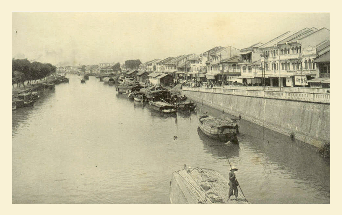 a black and white image of a river with houses on either side