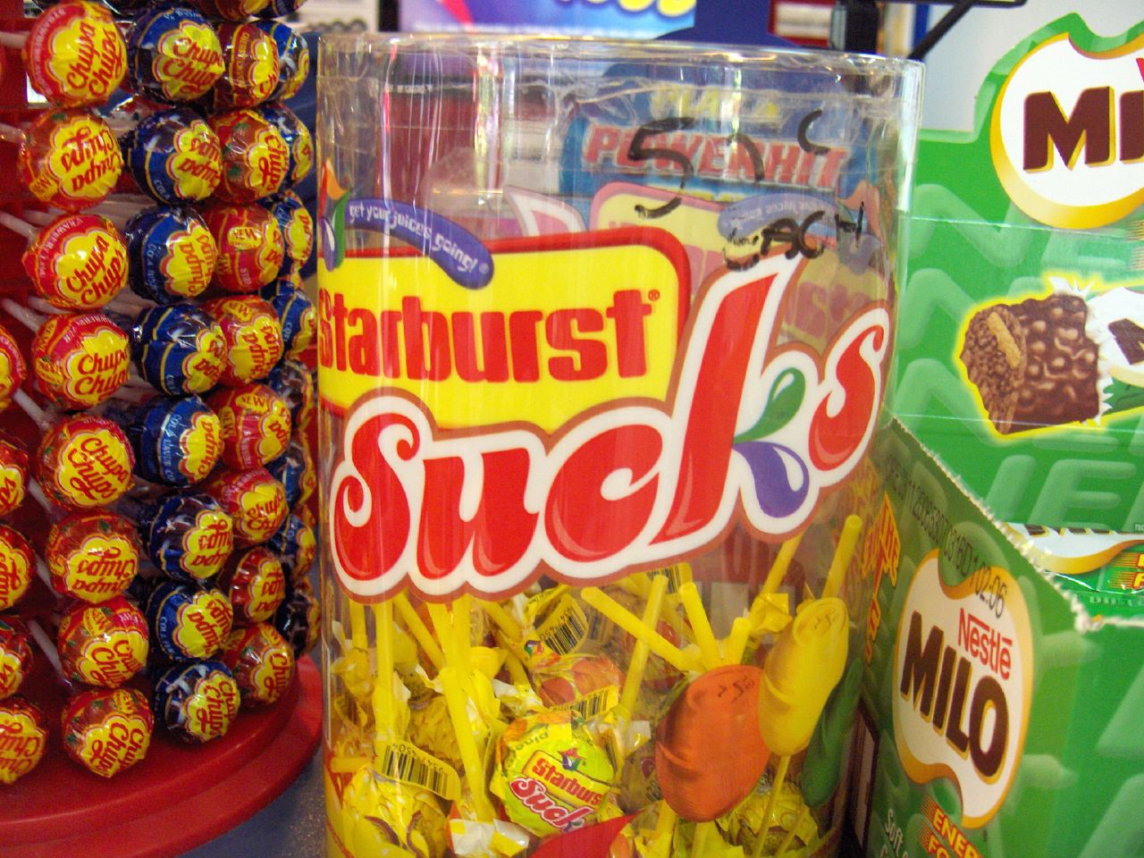a close up of some candy sticks on a shelf