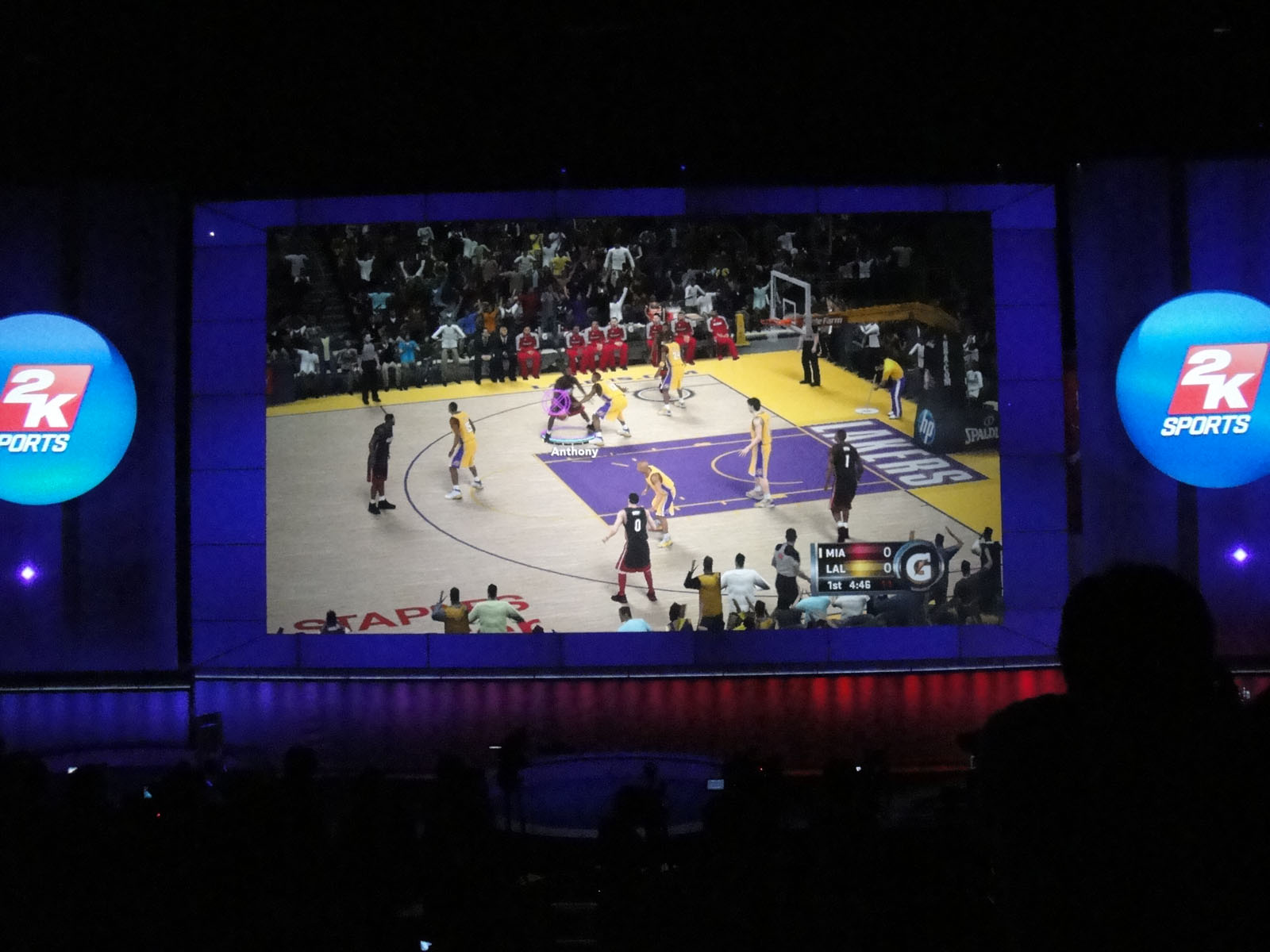 a large screen with basketball players on it