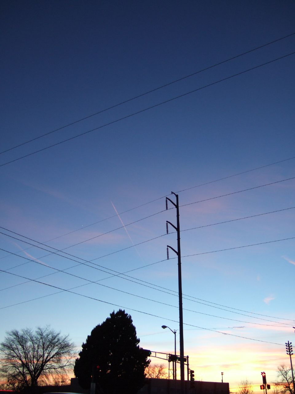 power lines above a building against the sky