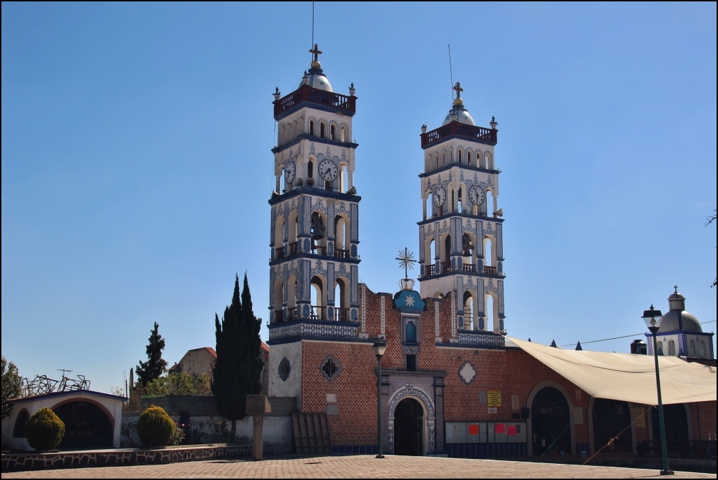 the clock tower has many bell towers on top