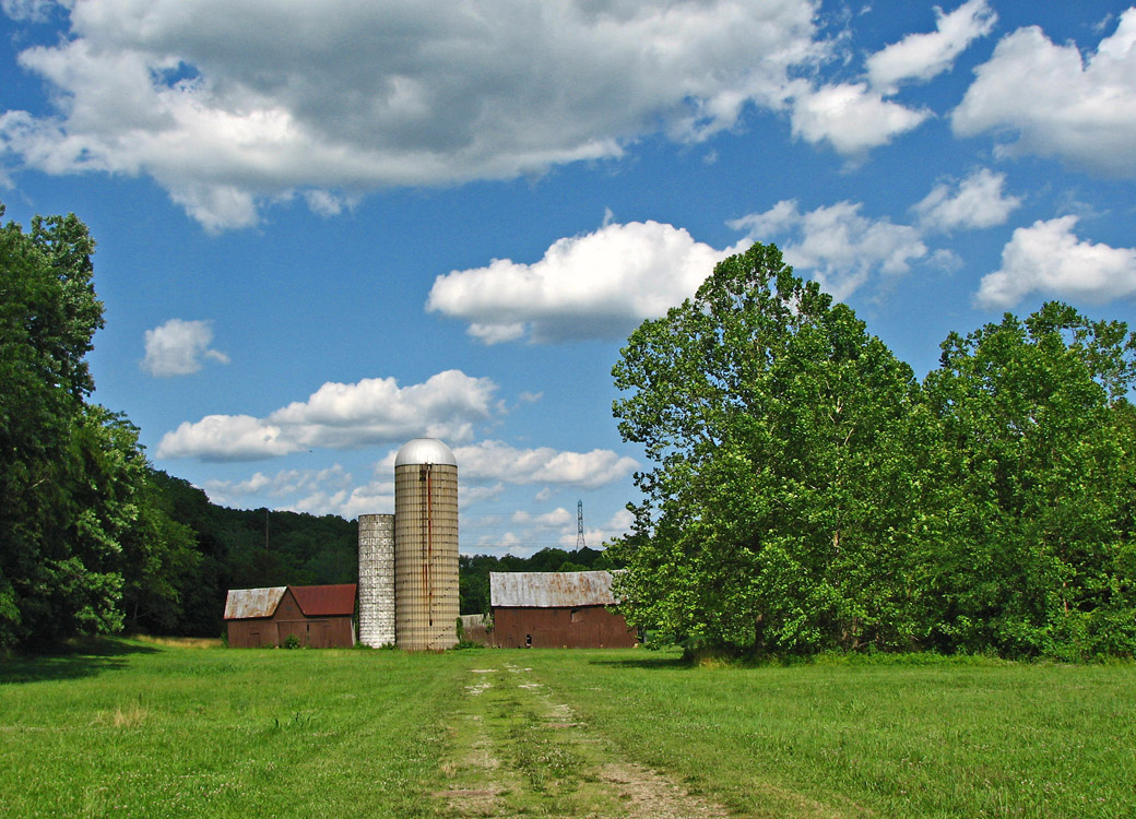 two buildings near each other on a dirt road