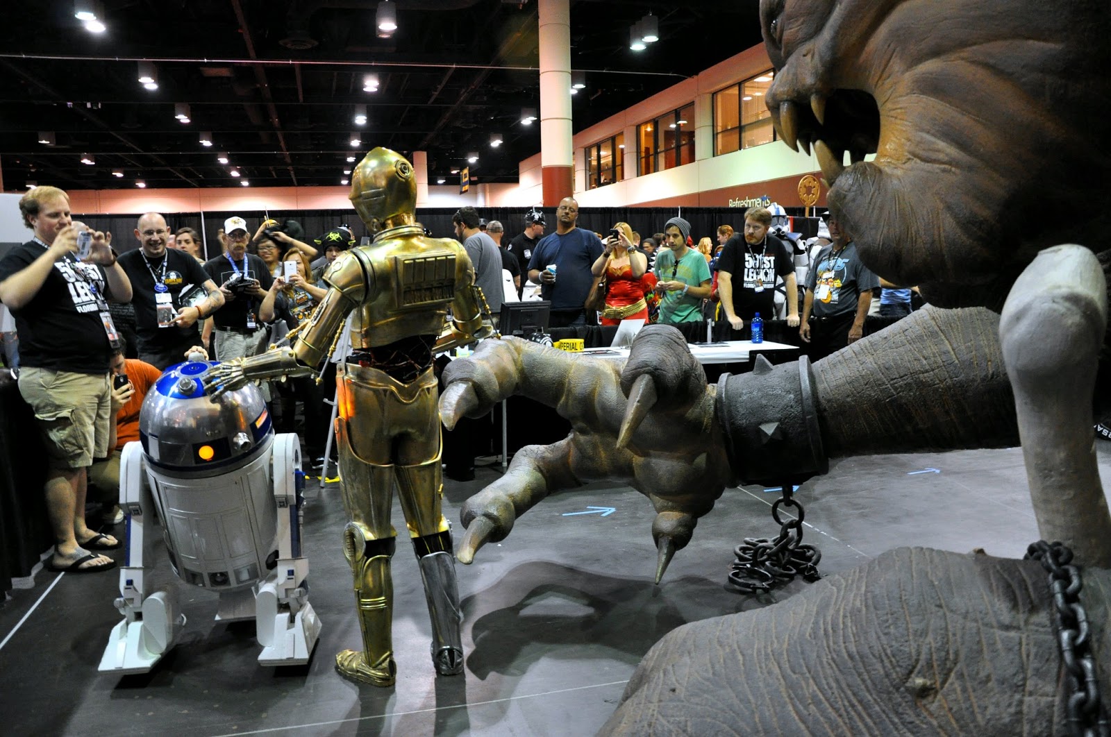 a star wars exhibit with an elephant being  to a robot