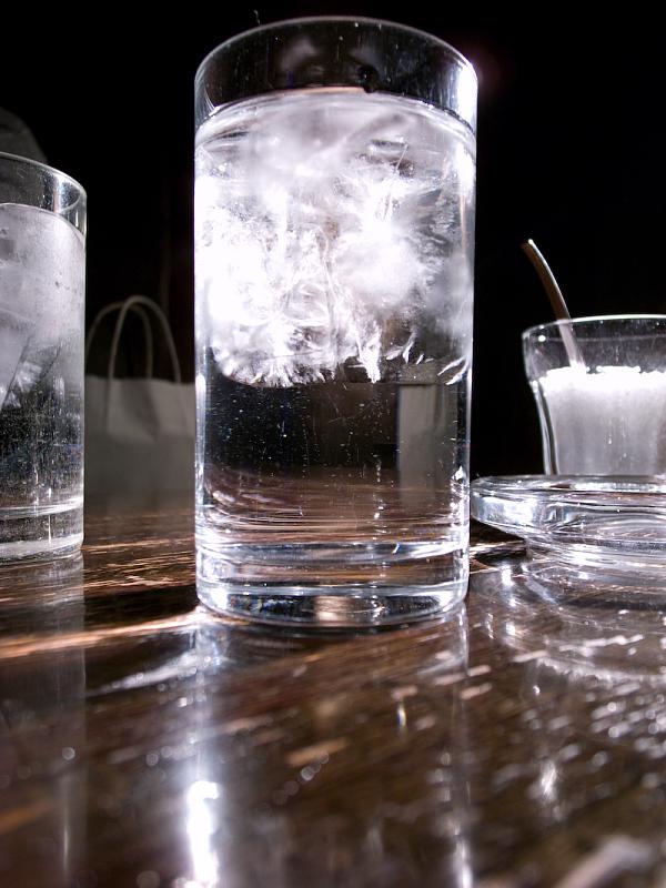 the ice is in the glass of water and some other beverages