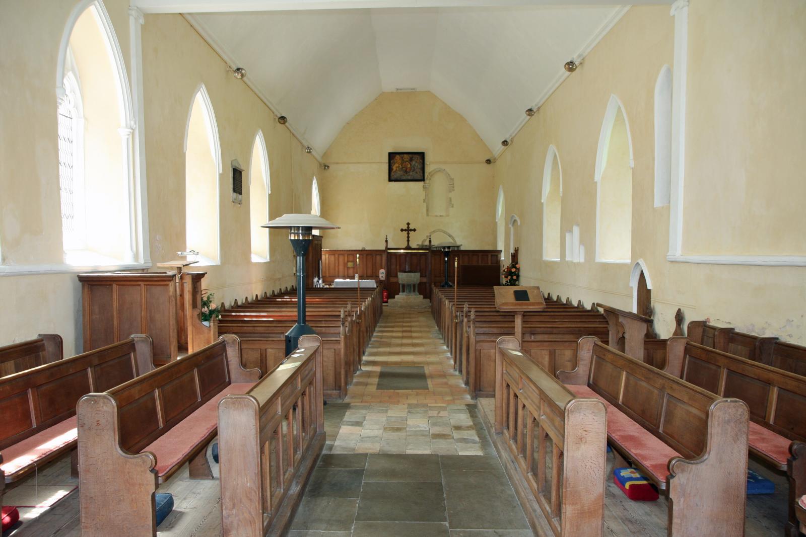 a church with pews in the middle and several windows