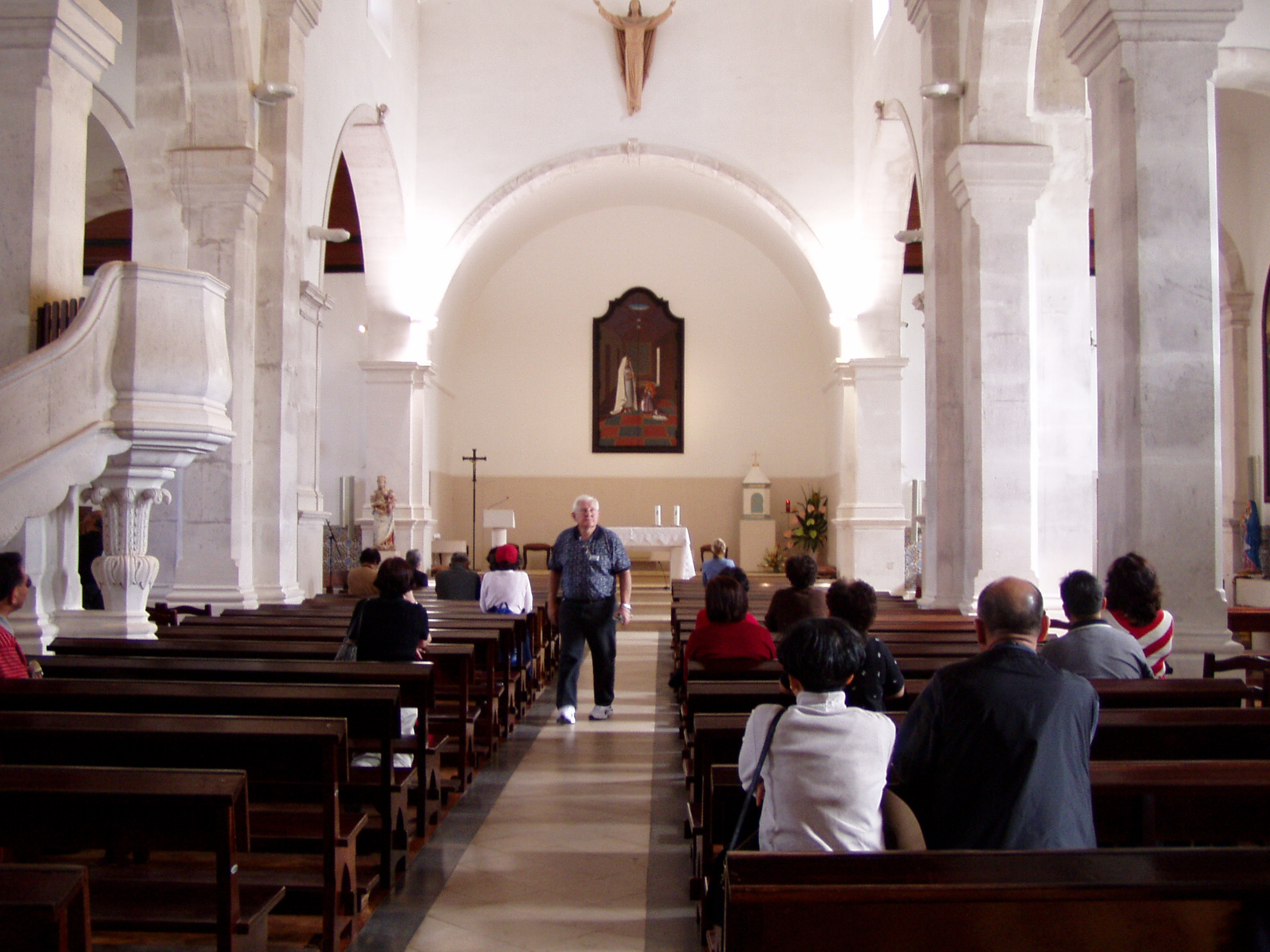 a group of people standing around in a church