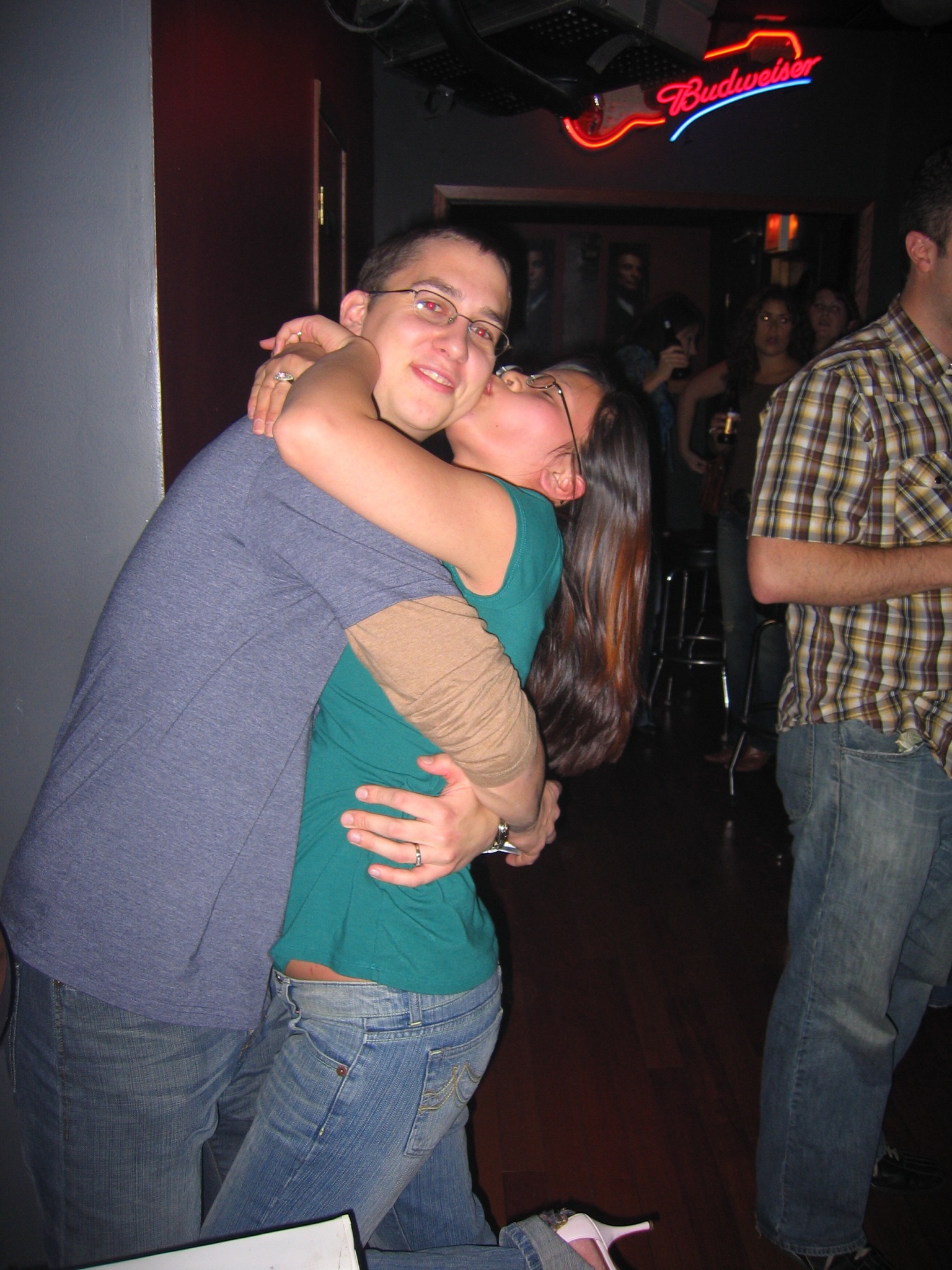 a woman holding another woman while standing on the ground