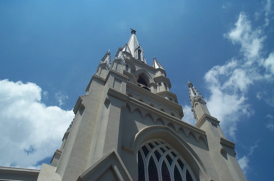 the tops of this tall church are very gothic