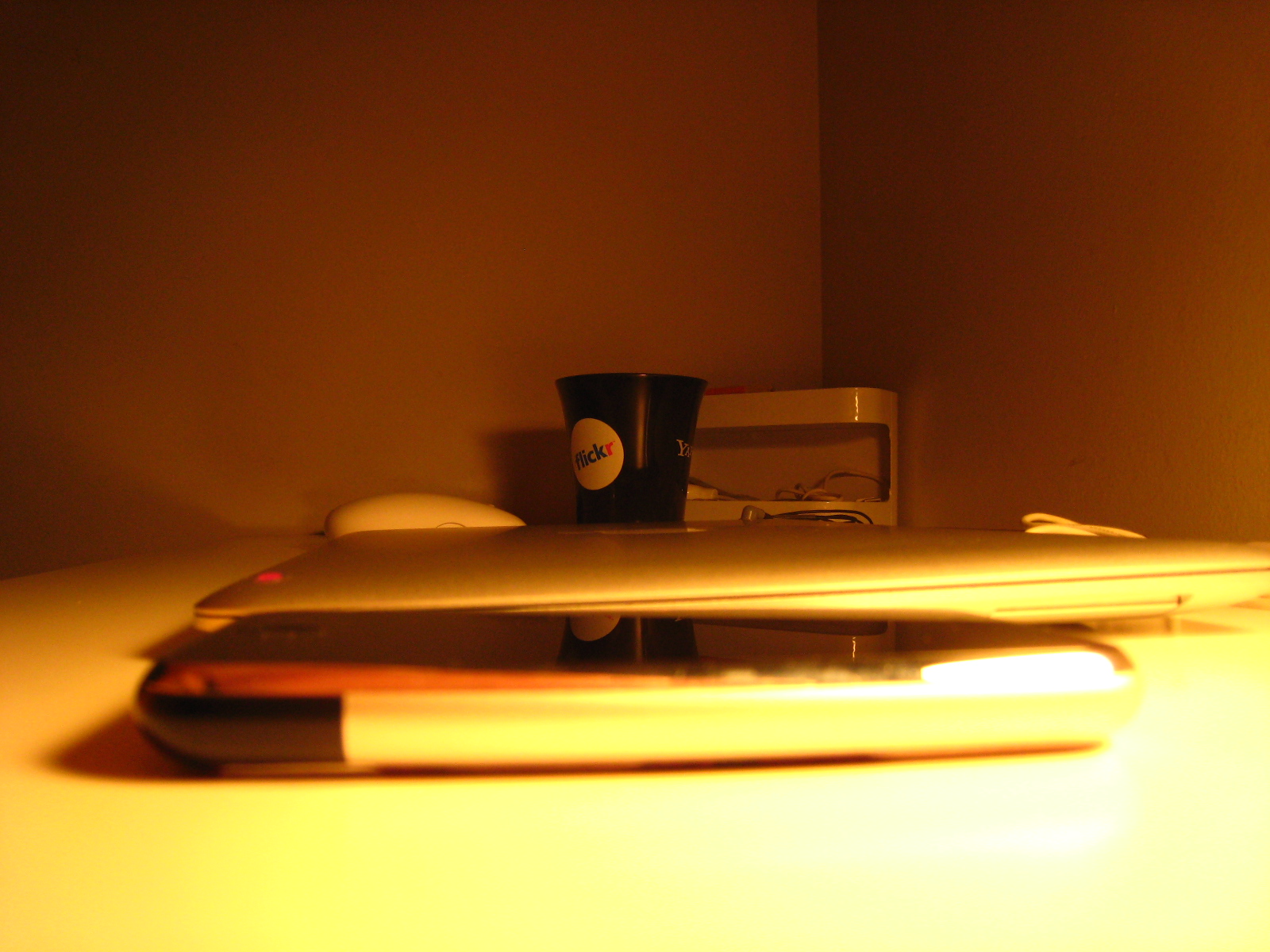 a laptop sitting on top of a white desk