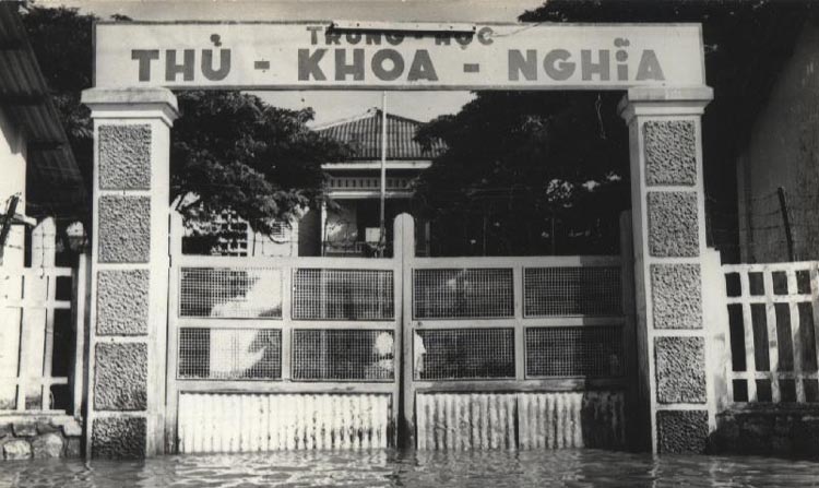 a large gated in building with a gate that says thu k hoa - ngha