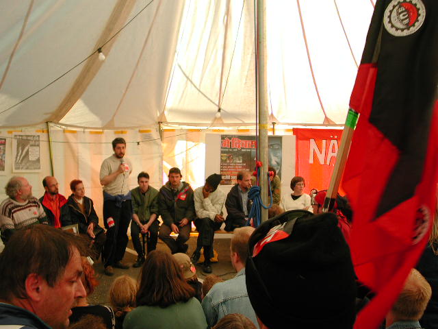 group of people gathered around some kind of tent