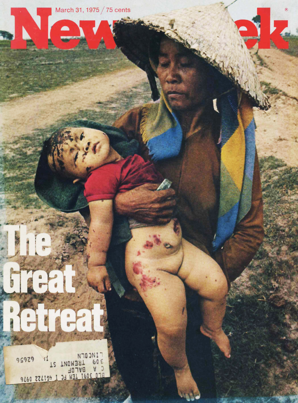 a woman holding a child, with  and skin smeared on it