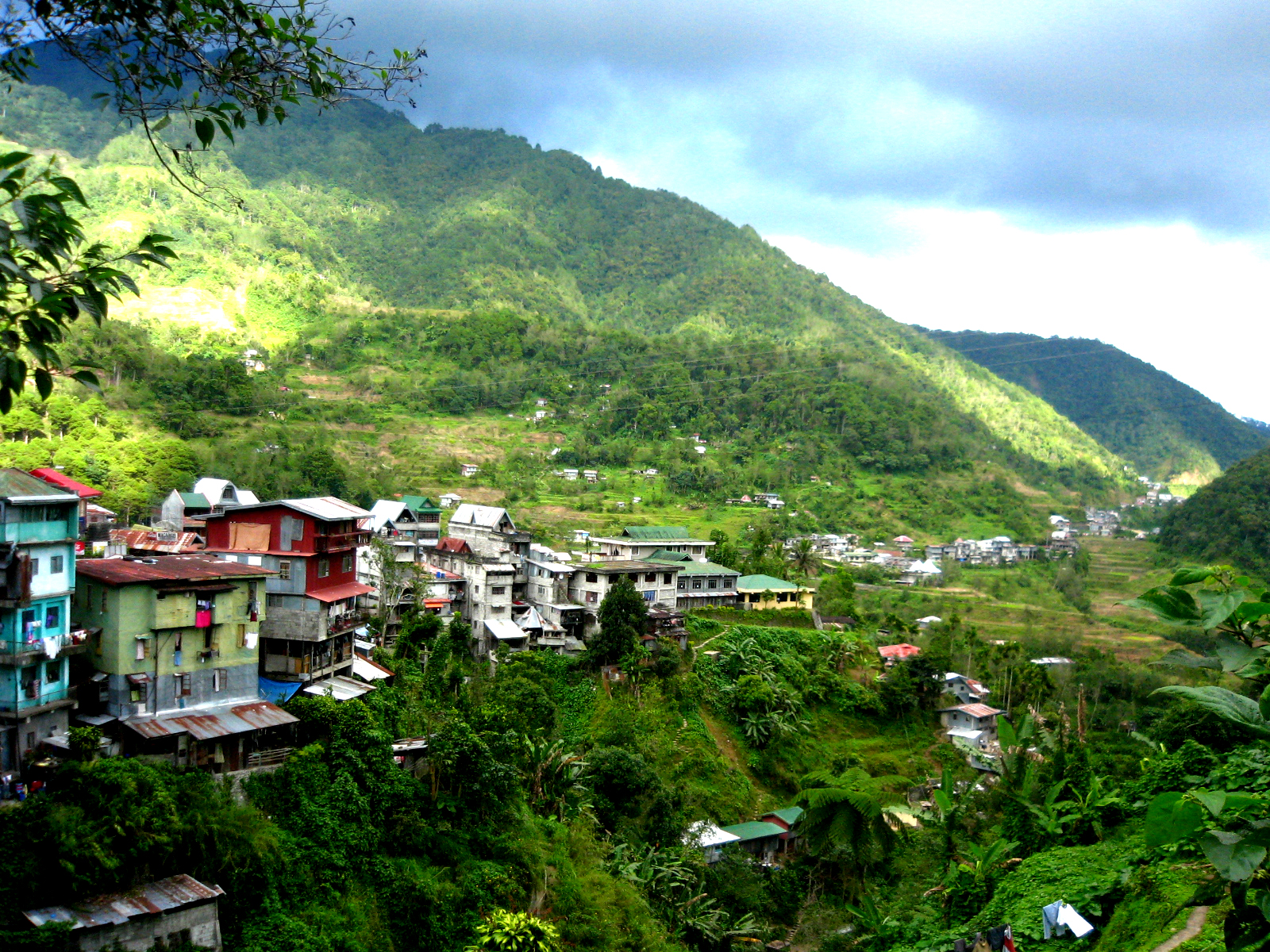 the mountainside is covered by houses and houses