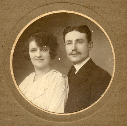 an old po of two people that are wearing suits and ties
