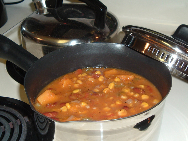 a pot with stew sits on the stove
