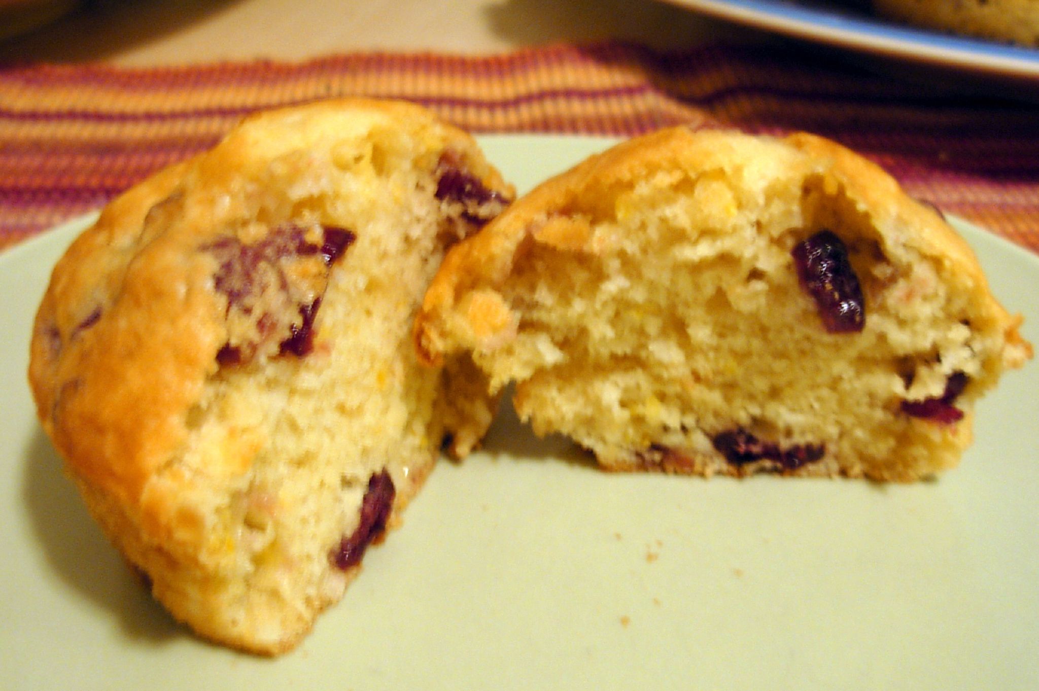 two pieces of the baked muffins sit on a plate