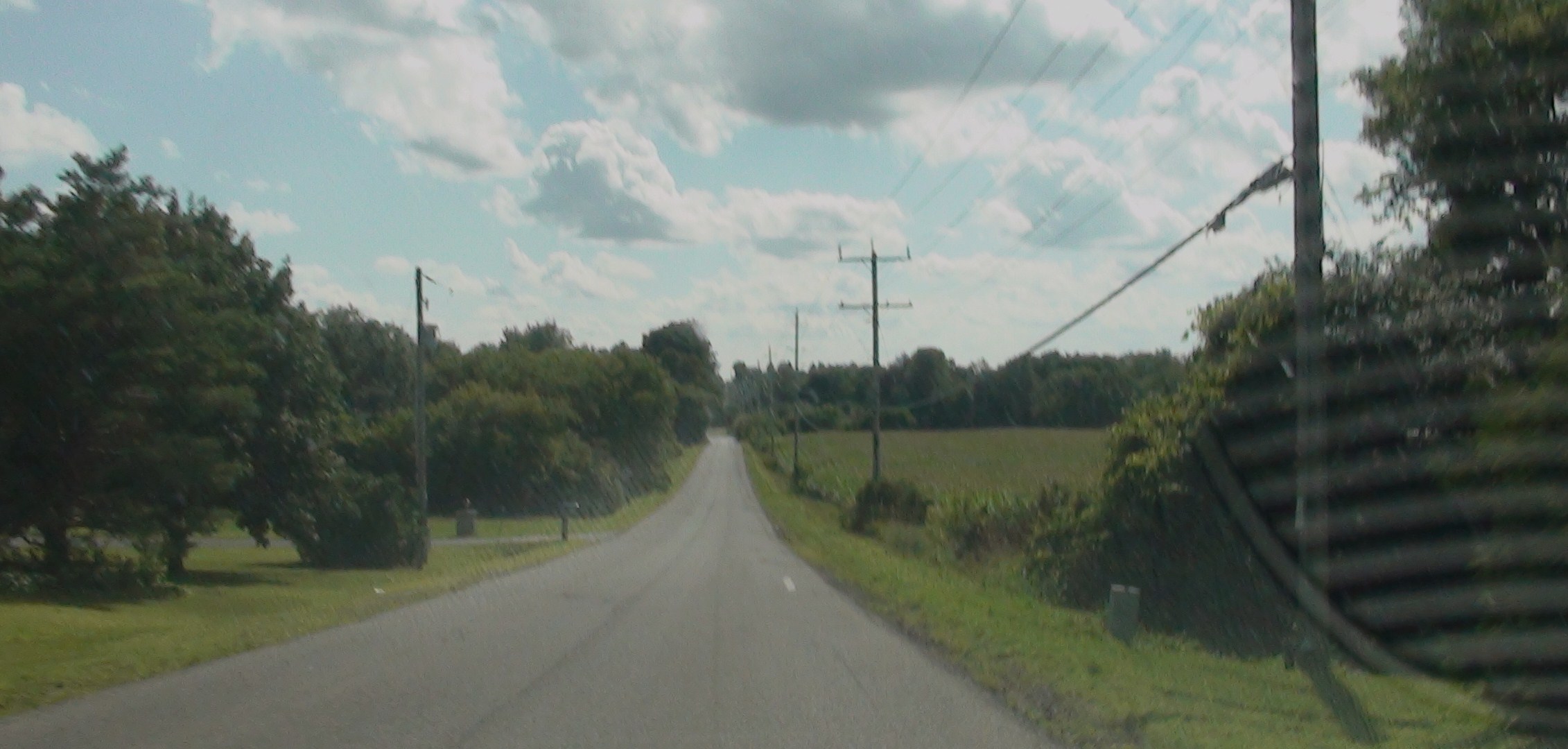 a view of a road from inside a vehicle