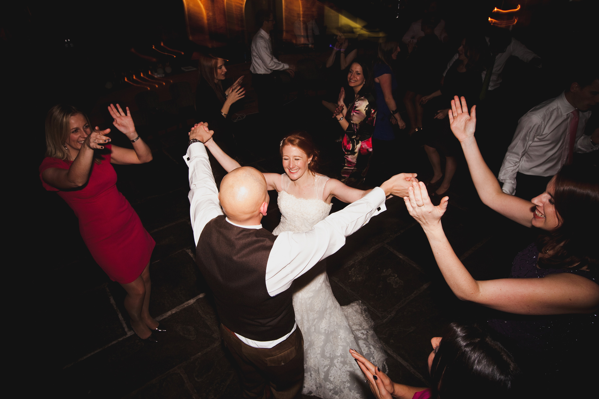 wedding couple dancing in a crowded dancefloor