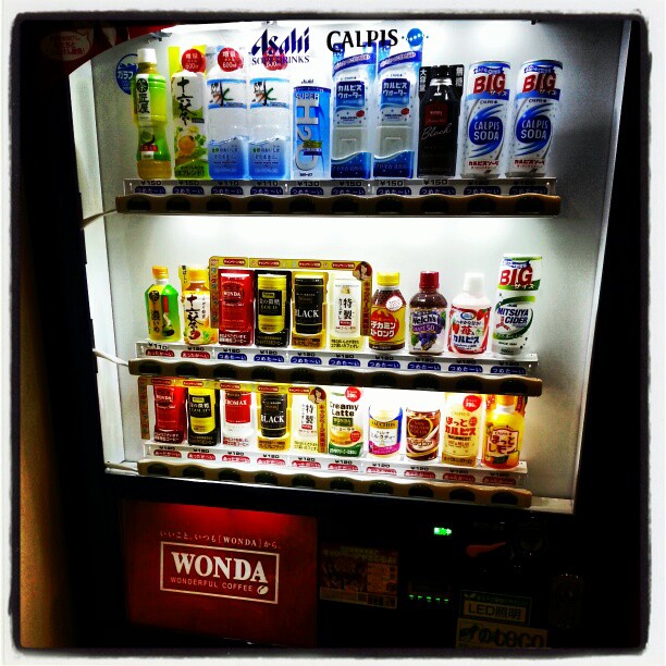 an empty drink machine displaying drinks and bottles