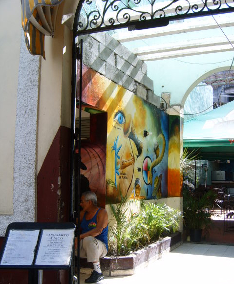 a building is decorated with a mural and other things