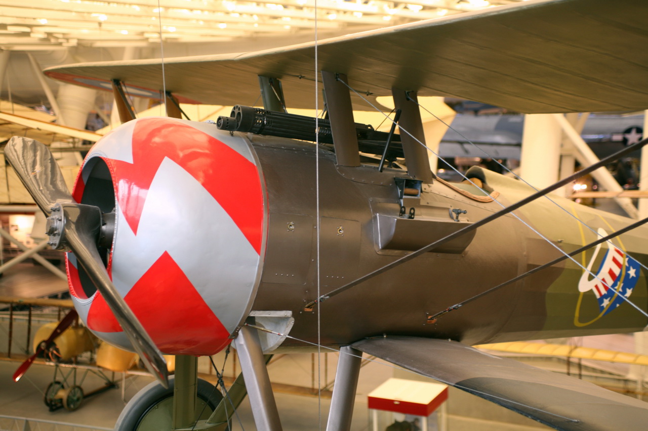 a single engine propeller plane displayed in a museum