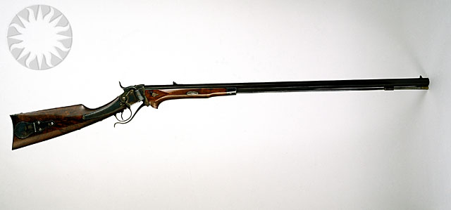 a winchester rifle mounted on the wall