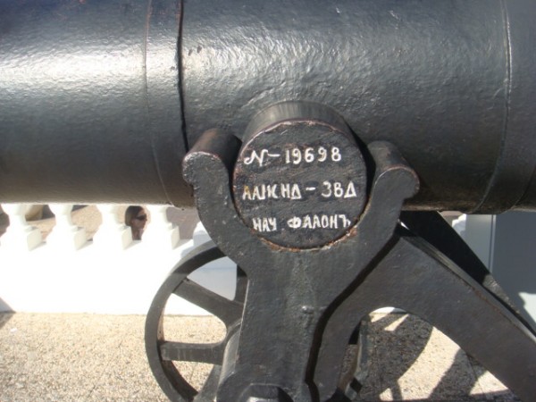 a large metal object with two black wheels