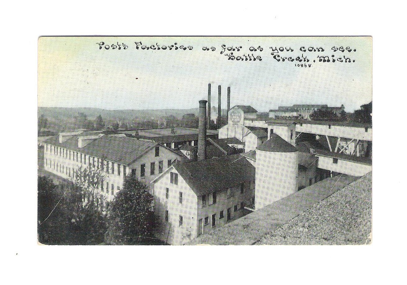the postcard shows an old city with a large tower