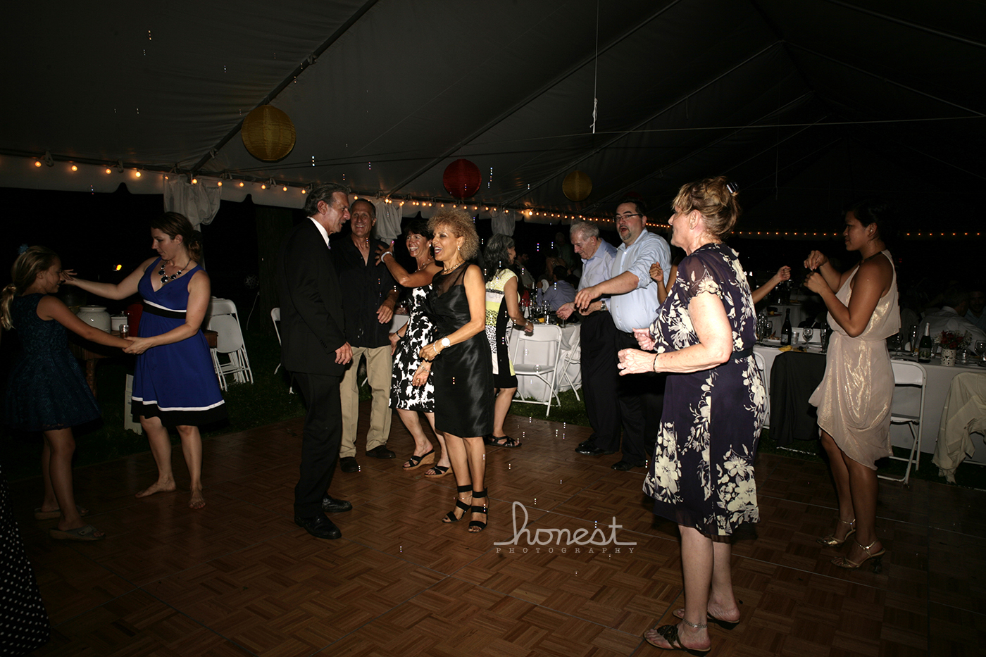 a group of people dancing at a social event